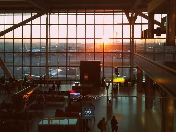 Heathrow Airport departure gate with setting sun through  window