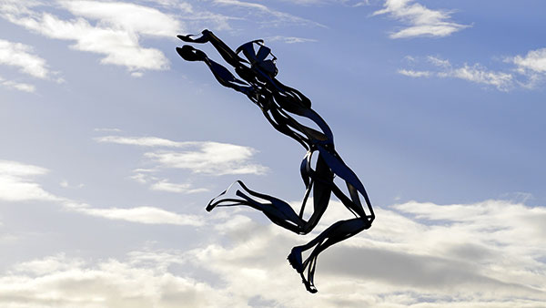 Flying man sculpture in Milton Keynes northamptonshire